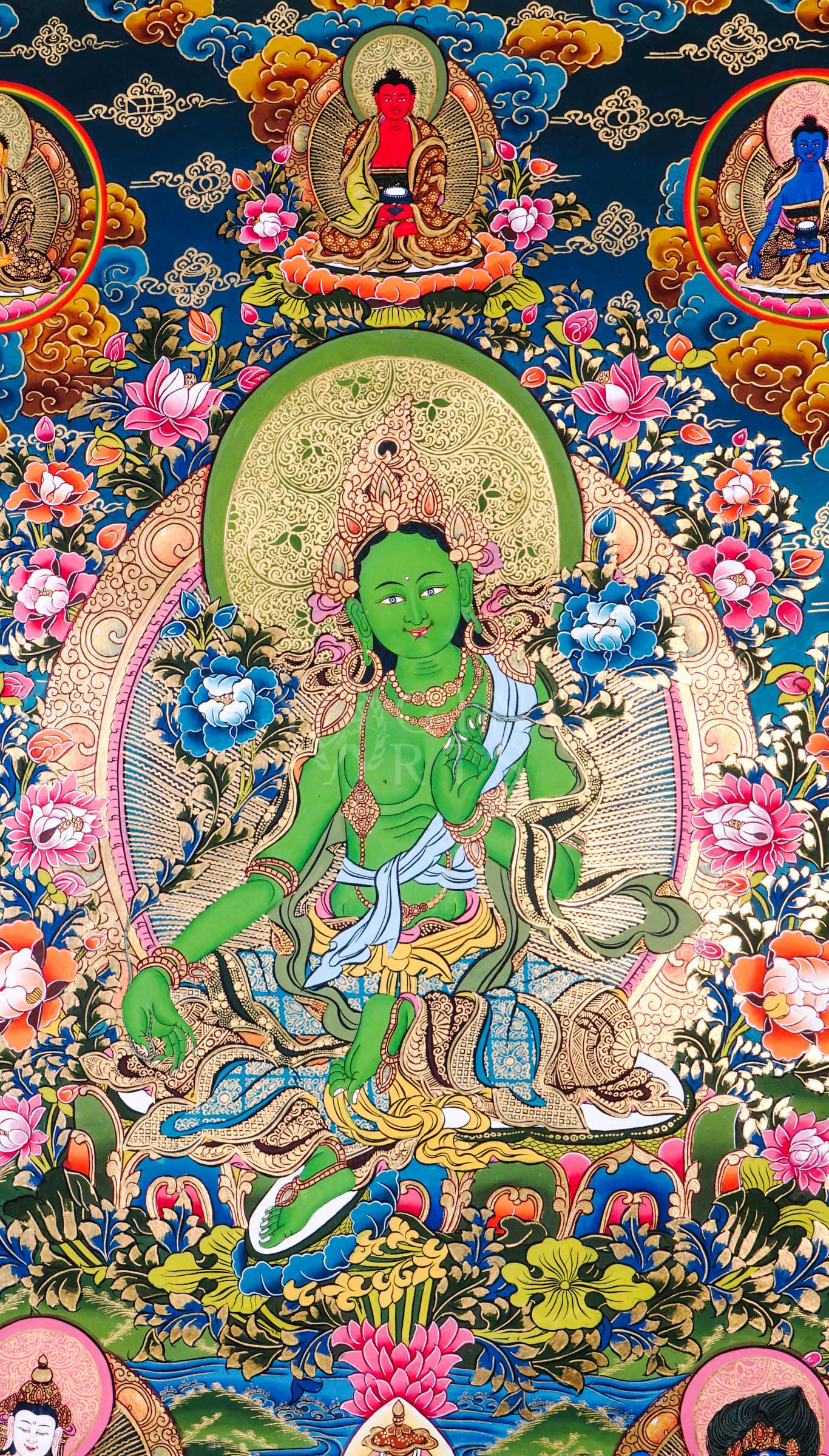 Traditional hand-painted Green Tara Tibetan thangka featuring the Buddhist goddess of compassion seated among lotus flowers with celestial Buddhas and sacred Himalayan motifs