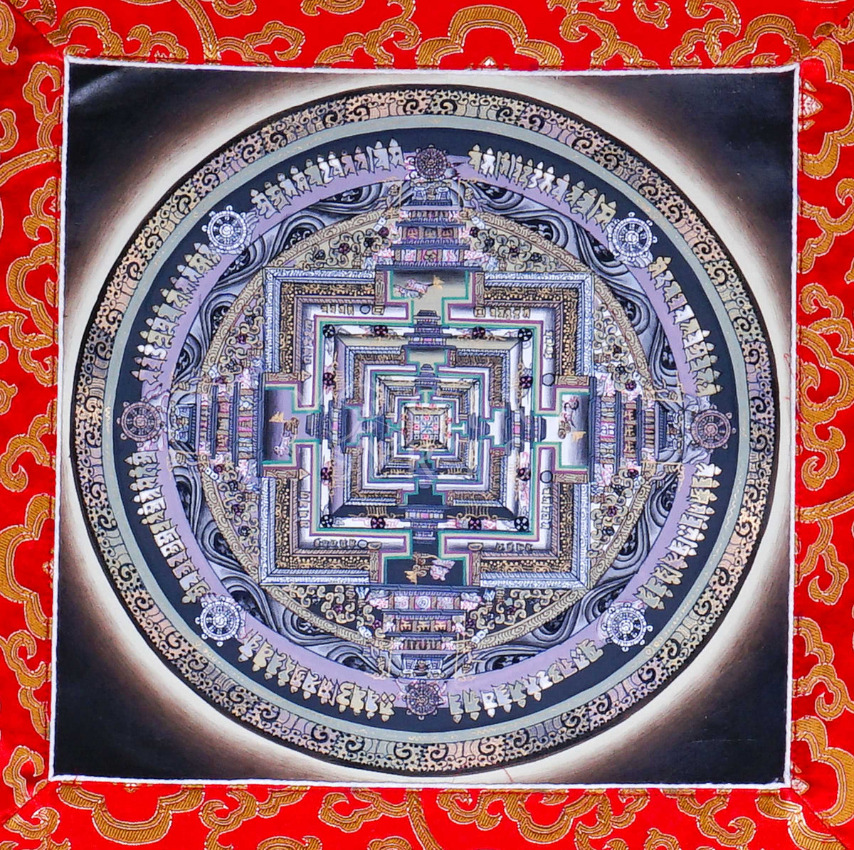 Hand-painted Kalachakra Mandala Brocade Thangka mounted in traditional Tibetan silk brocade, handcrafted in Nepal and ready to hang for meditation, altar, and sacred wall décor.