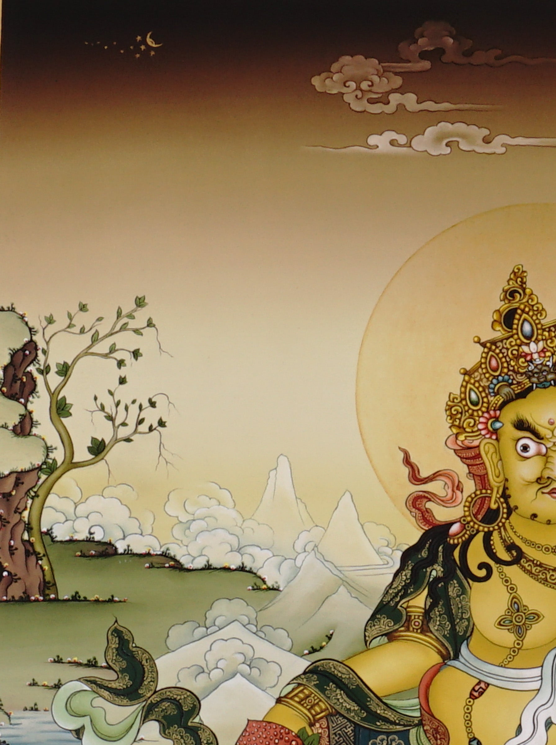 Hand-painted Yellow Dzambhala thangka showing Tibetan wealth deity seated on lotus throne holding mongoose and citron, with gold detailing and Himalayan landscape background.