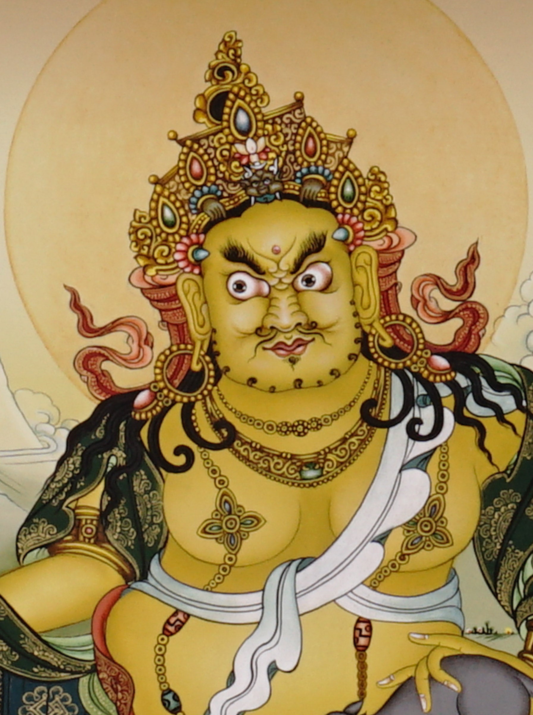 Hand-painted Yellow Dzambhala thangka showing Tibetan wealth deity seated on lotus throne holding mongoose and citron, with gold detailing and Himalayan landscape background.