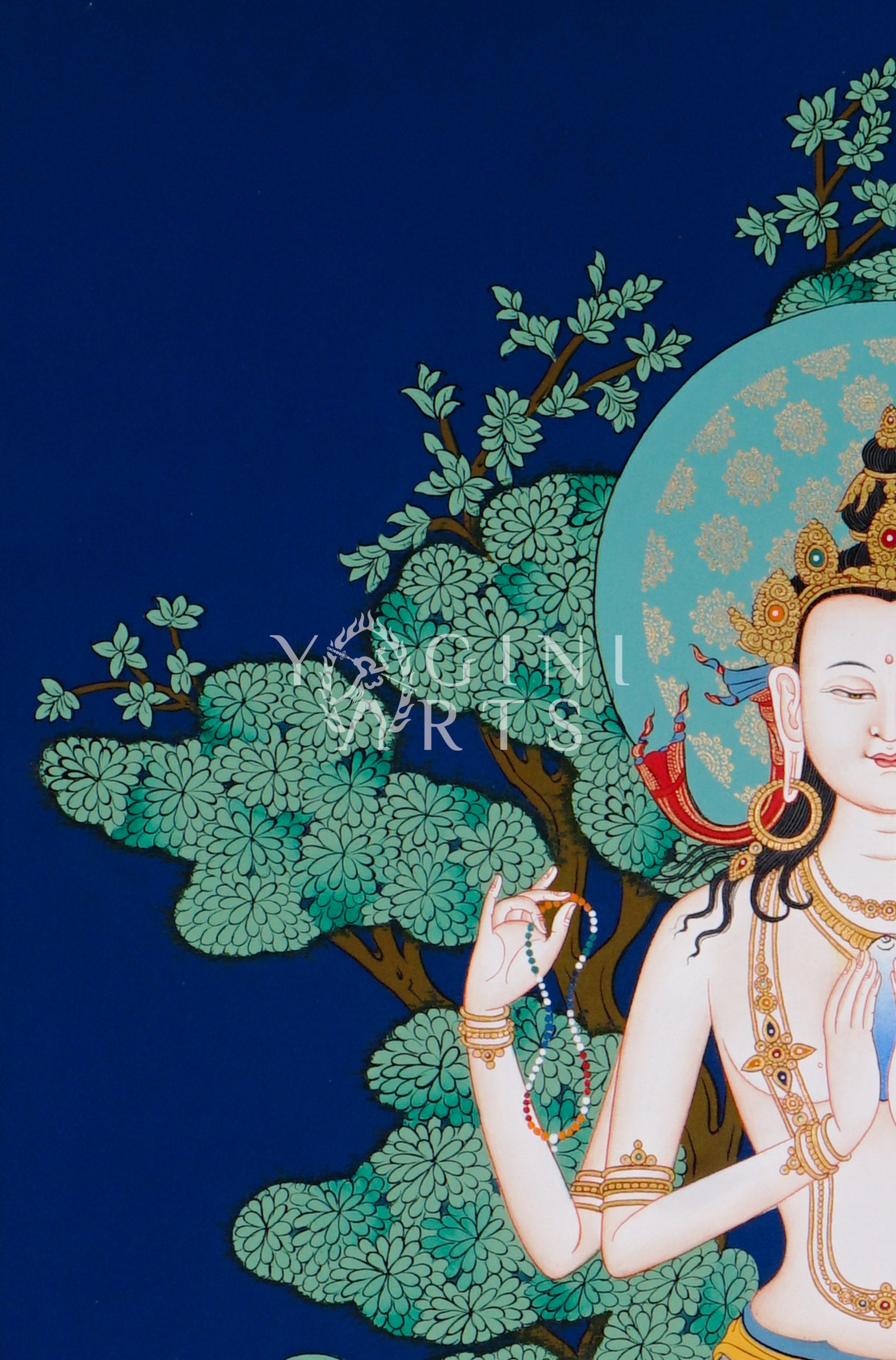 Hand-painted Chenrezig thangka featuring the four-armed Avalokiteshvara seated on a lotus throne with mala beads and lotus flower against a deep blue background