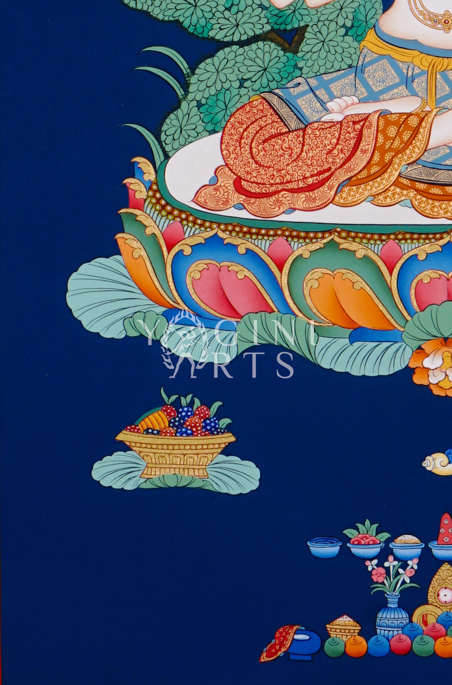 Hand-painted Chenrezig thangka featuring the four-armed Avalokiteshvara seated on a lotus throne with mala beads and lotus flower against a deep blue background