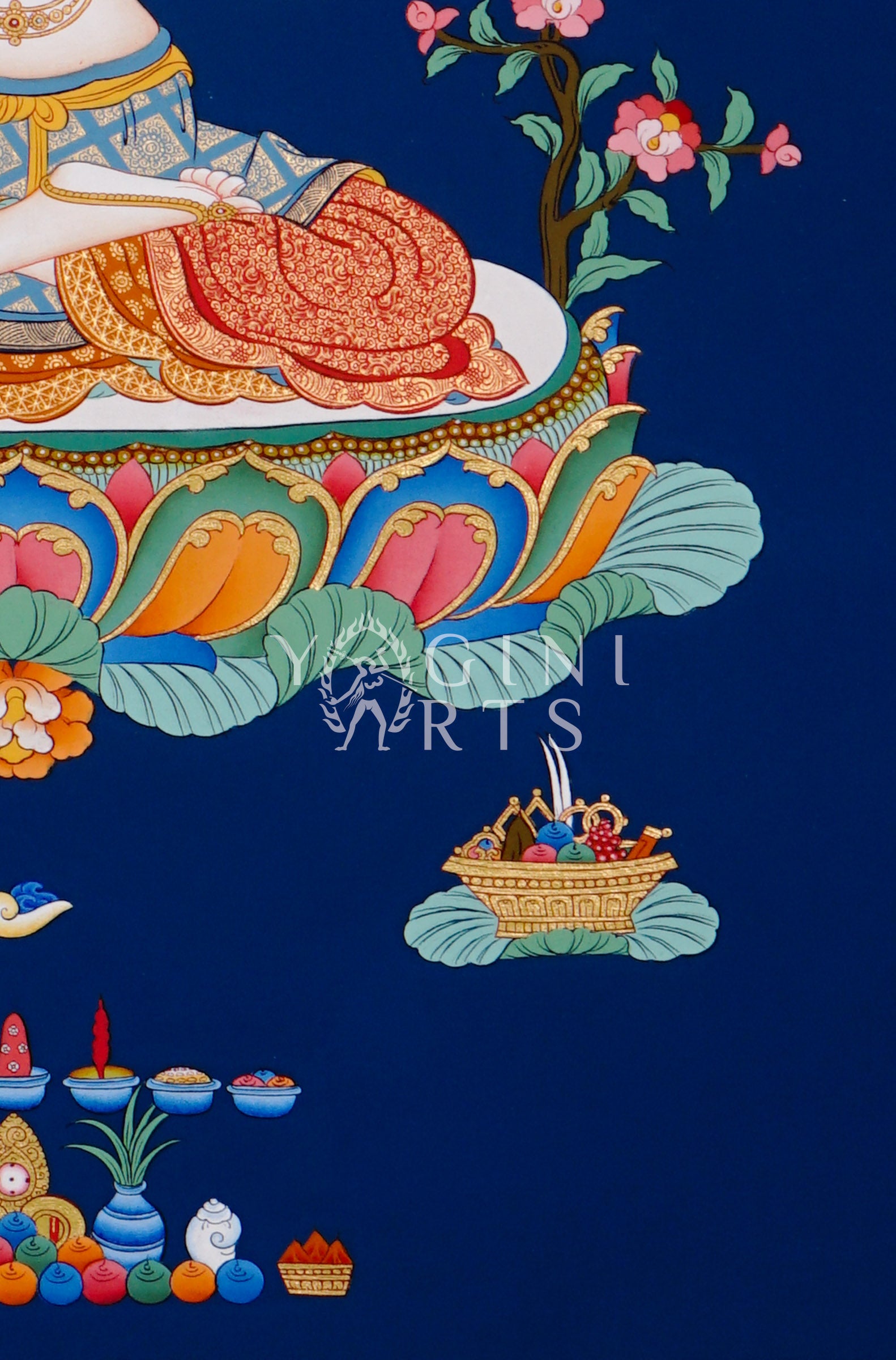 Hand-painted Chenrezig thangka featuring the four-armed Avalokiteshvara seated on a lotus throne with mala beads and lotus flower against a deep blue background