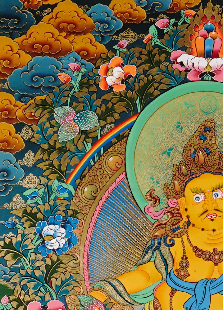 Hand-painted Yellow Zambhala thangka showing wealth deity seated on lotus with mongoose and rainbow halo.