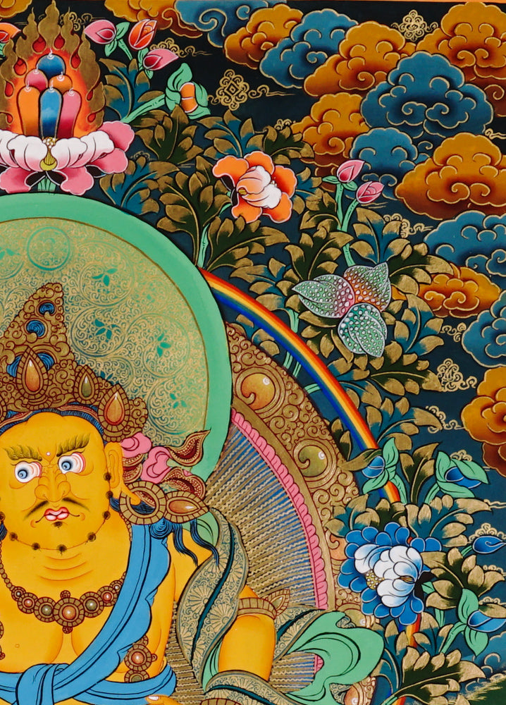 Hand-painted Yellow Zambhala thangka showing wealth deity seated on lotus with mongoose and rainbow halo.