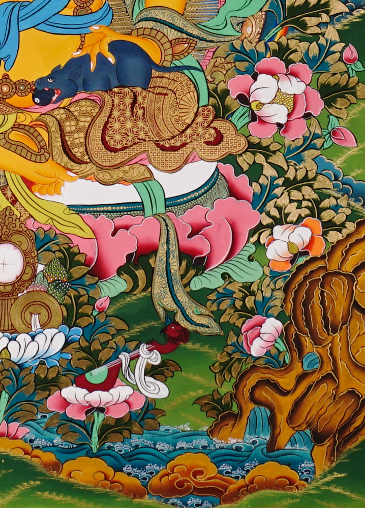 Hand-painted Yellow Zambhala thangka showing wealth deity seated on lotus with mongoose and rainbow halo.