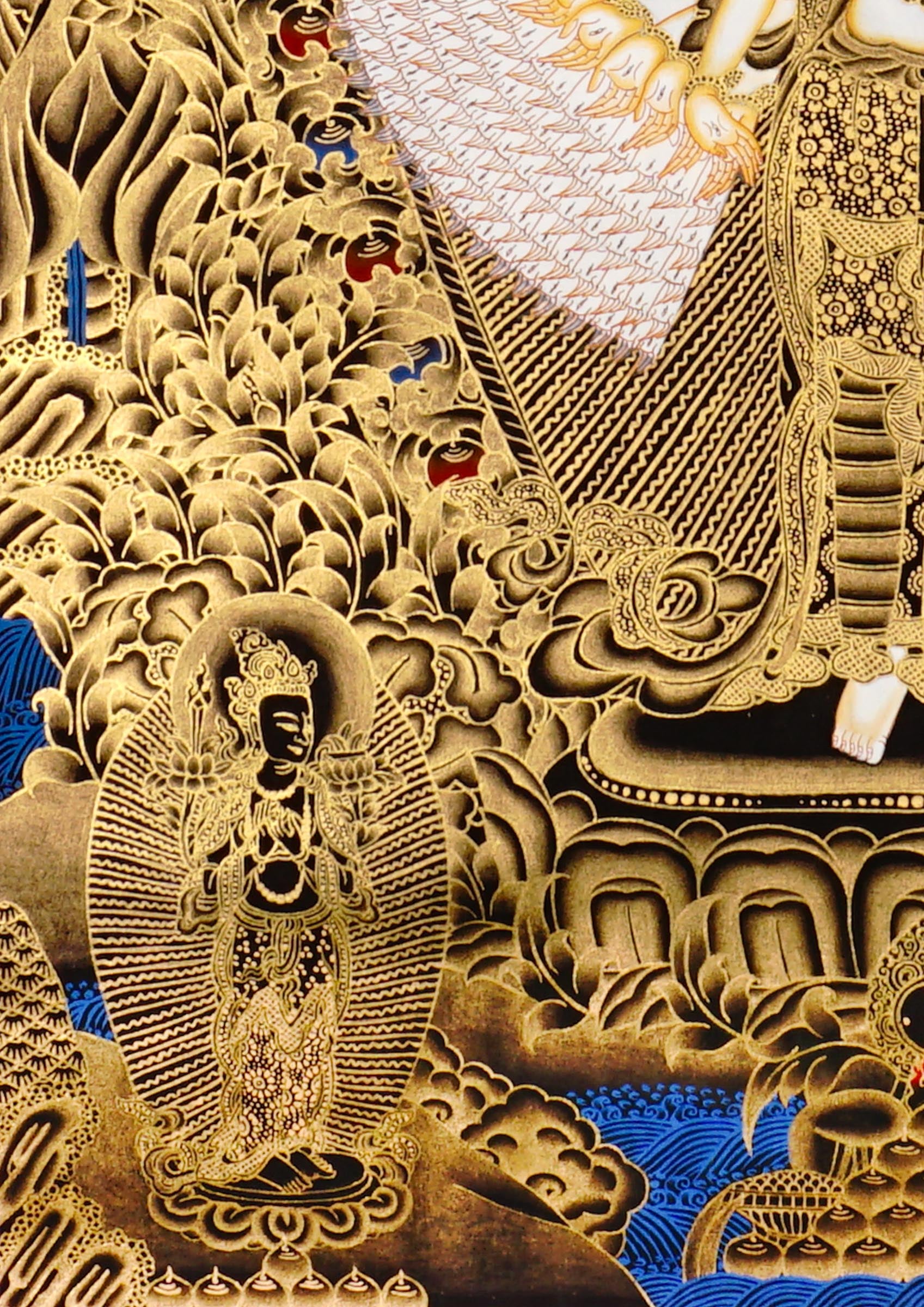 Hand-painted Thousand-Armed Avalokiteshvara thangka in gold on black background showing eleven-faced Chenrezig with multiple arms standing on lotus pedestal.