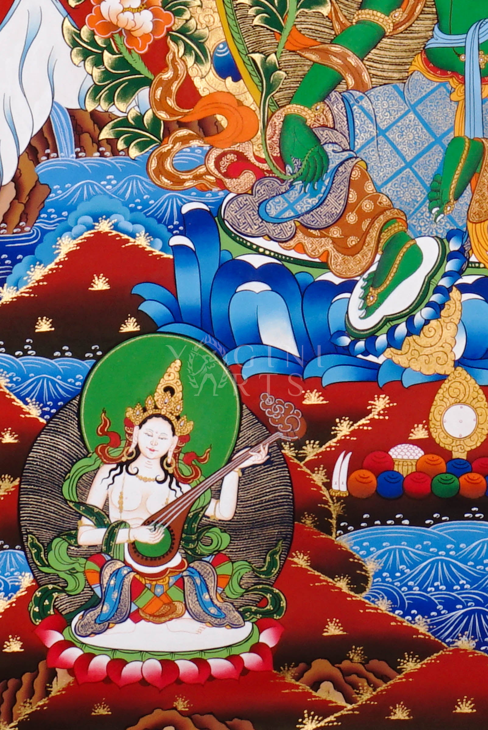 Green Tara thangka featuring the bodhisattva seated on a lotus throne with lotus flowers, surrounded by celestial figures and vibrant Himalayan landscape.