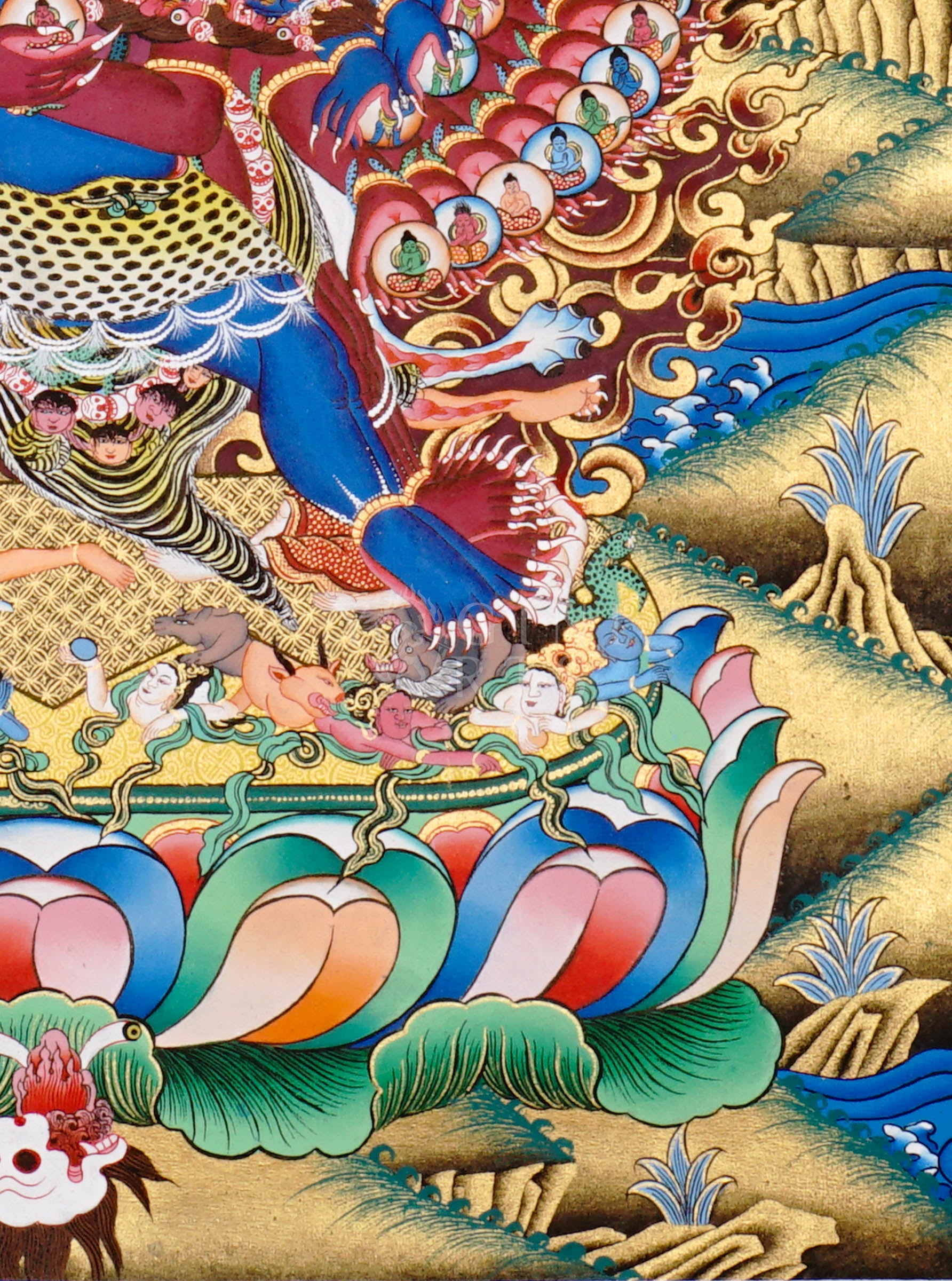 Heruka thangka showing a multi-headed, multi-armed wrathful tantric deity dancing on figures, surrounded by flames and intricate symbolic elements.