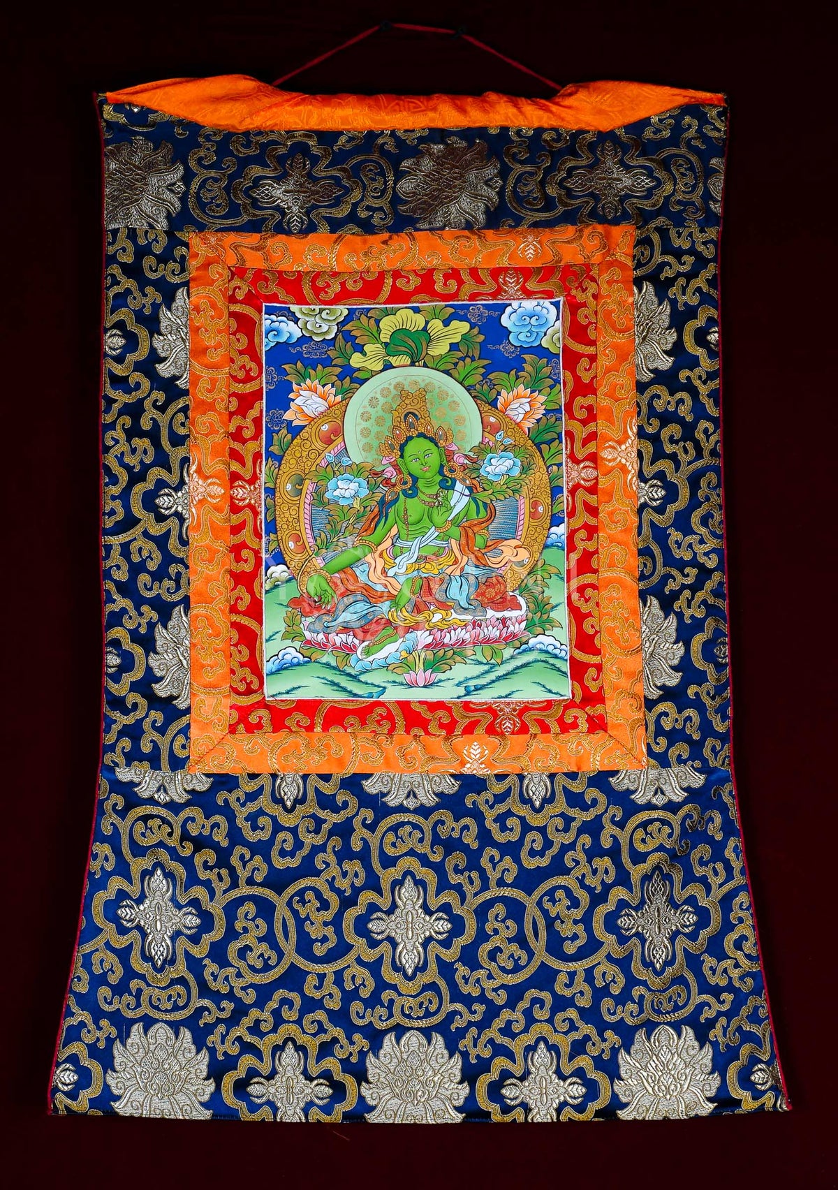 Hand-painted Green Tara Brocade Thangka mounted in traditional Tibetan silk brocade, handcrafted in Nepal for Buddhist meditation, altar decoration, and sacred wall décor.