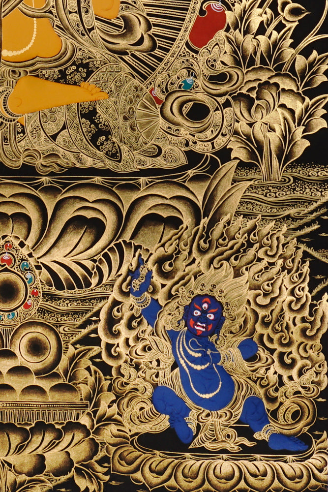 Gold-on-black Manjushri thangka depicting the Bodhisattva of wisdom holding the flaming sword and lotus scripture.