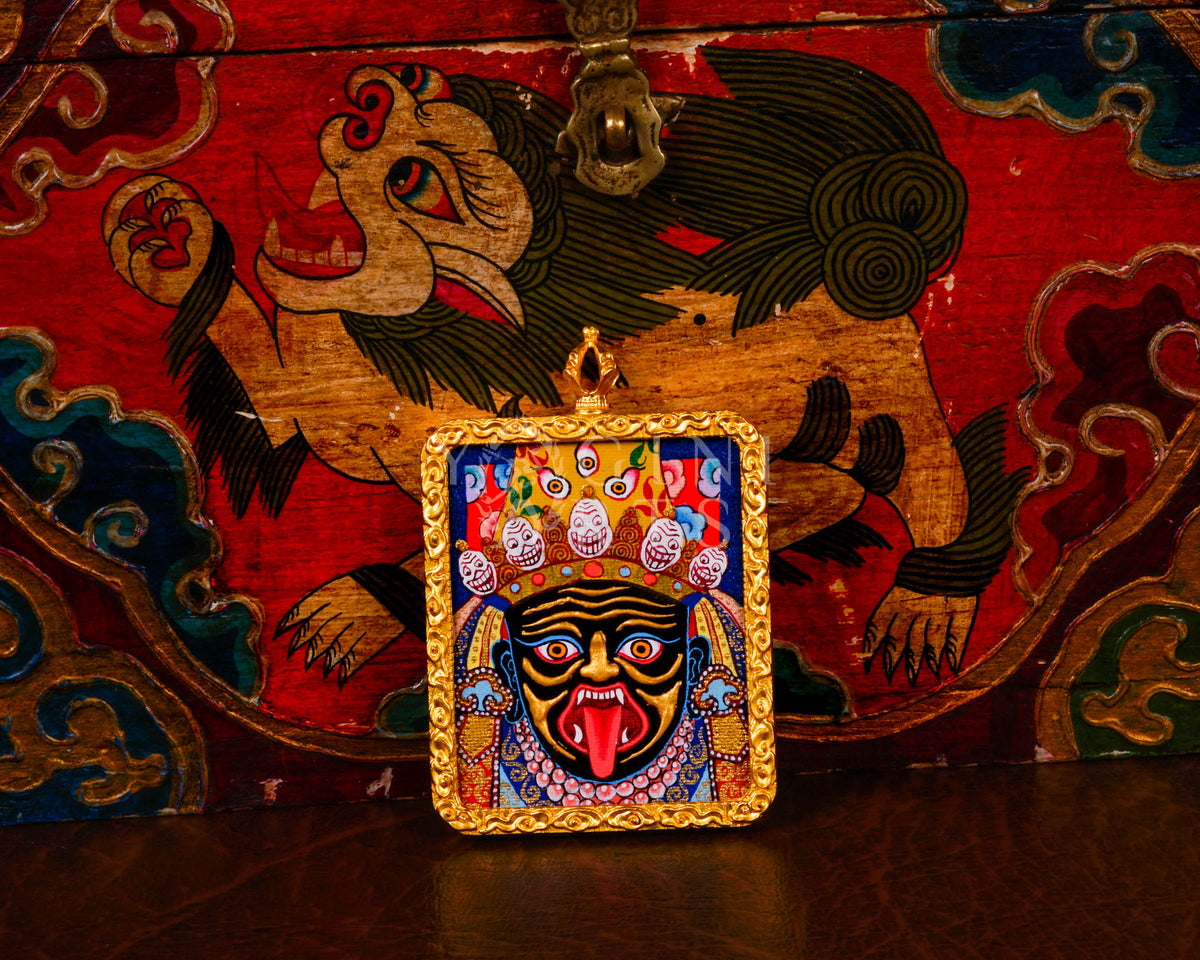 Hand-painted Zhaji Lhamo Ghau pendant in a gold-tone frame, handcrafted in Nepal using traditional Tibetan miniature painting techniques.
