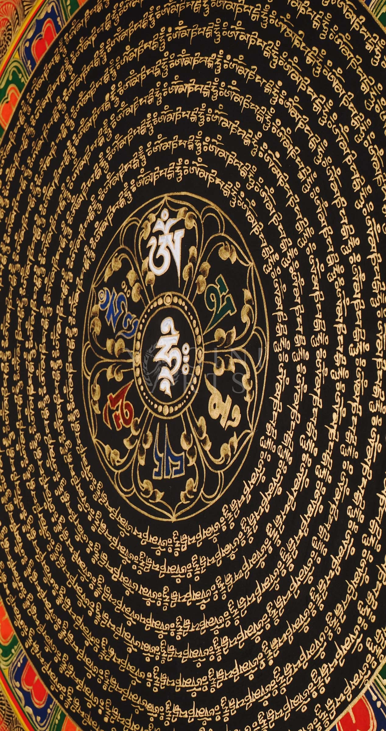 Tibetan mantra mandala thangka on black background with gold script, floral corner designs, and sacred border text.