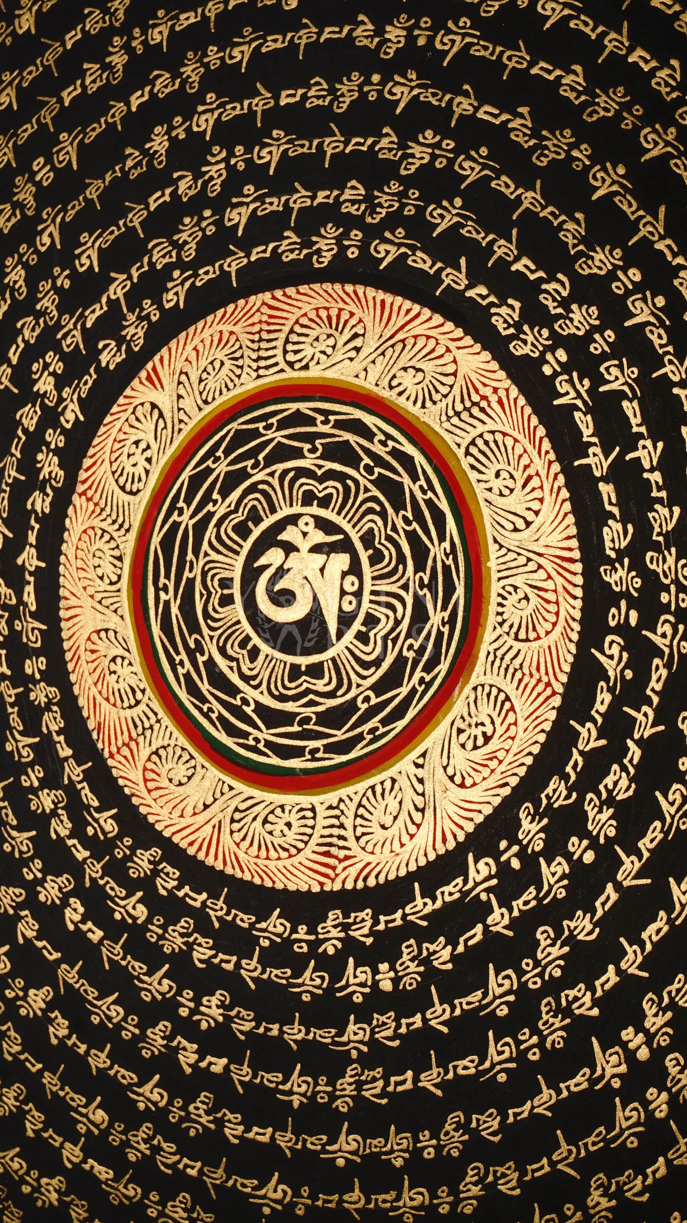 Tibetan mantra mandala thangka with black background, gold script rings, bold red outer mantra band, and floral corner decorations.