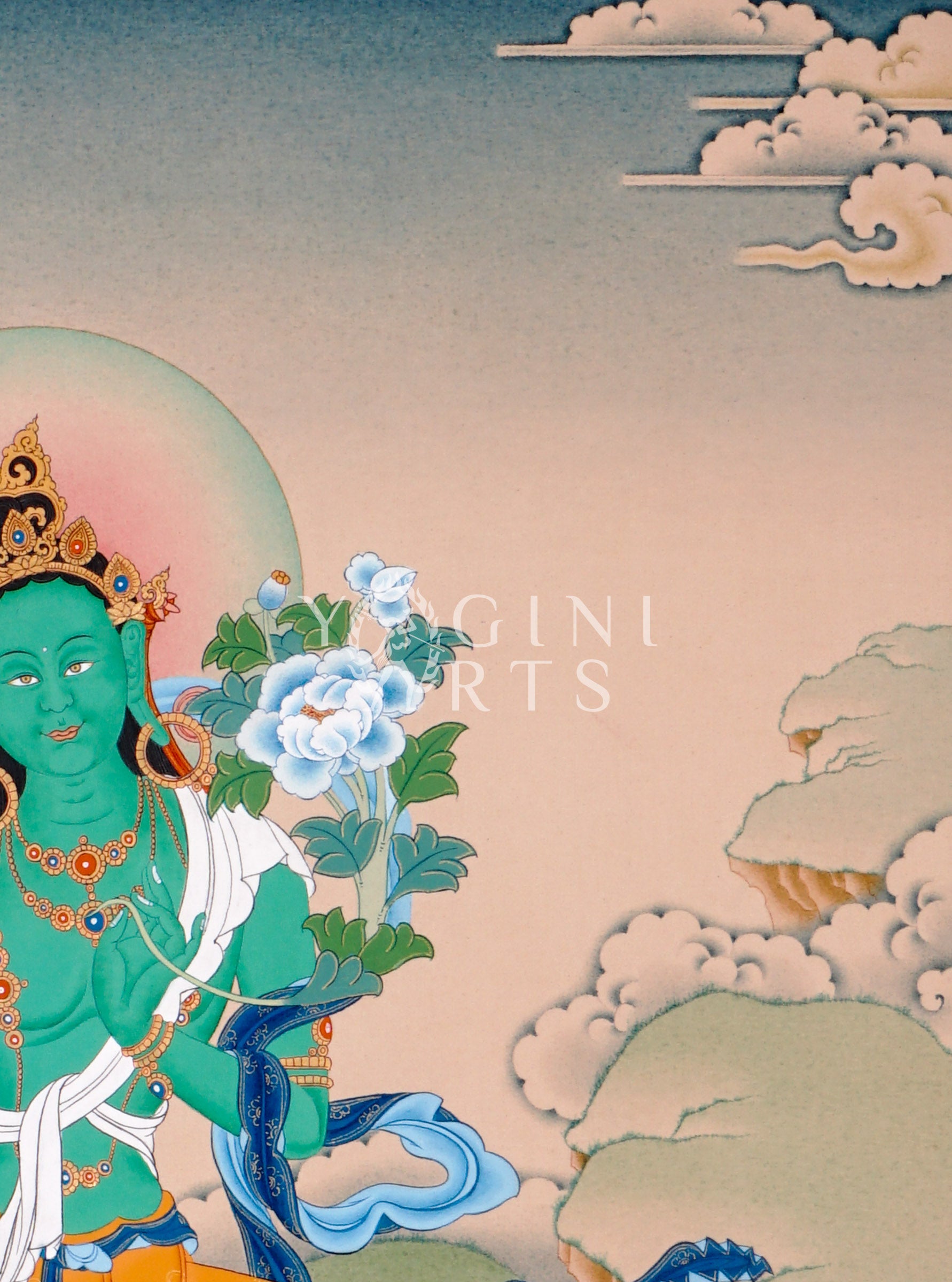 Hand-painted Green Tara thangka featuring the Tibetan Buddhist goddess seated on a lotus throne holding a blue lotus flower in a peaceful Himalayan landscape