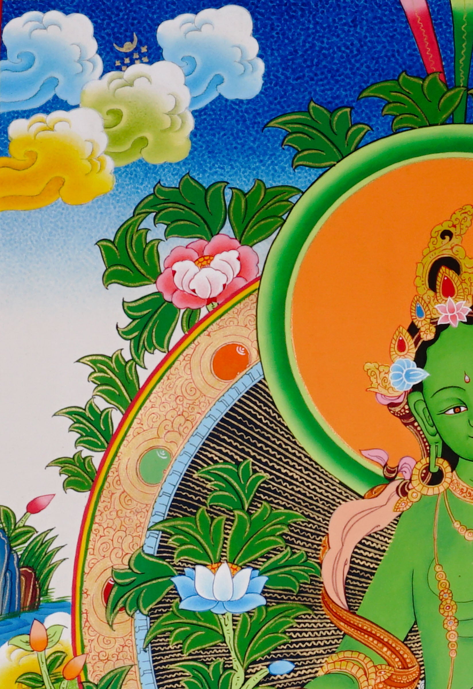 Green Tara thangka featuring the Tibetan Buddhist goddess seated on a lotus throne surrounded by flowers and sacred Himalayan landscape