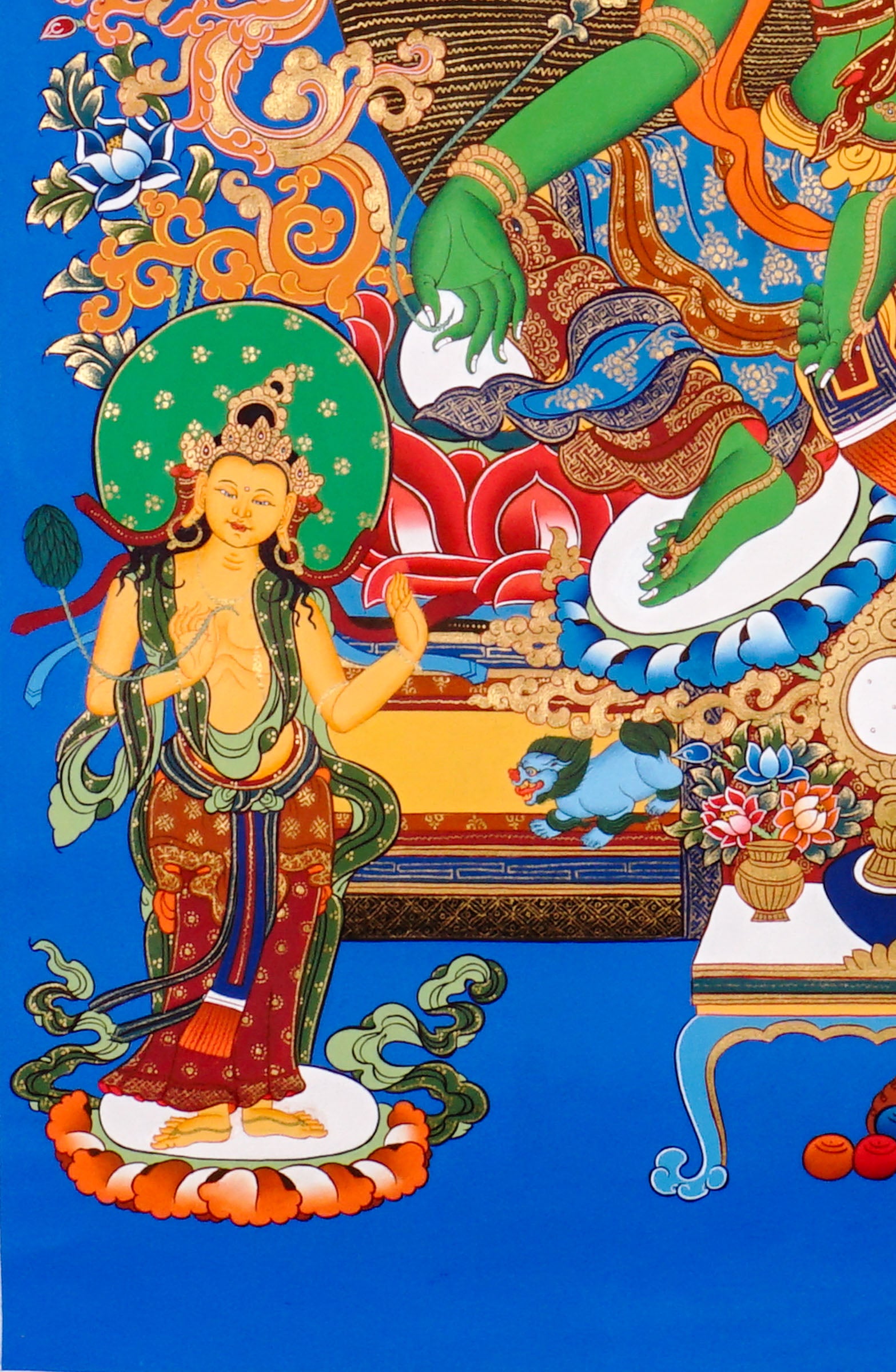 Hand-painted Green Tara thangka featuring the Tibetan Buddhist goddess seated on a lotus throne surrounded by sacred floral motifs and celestial symbolism