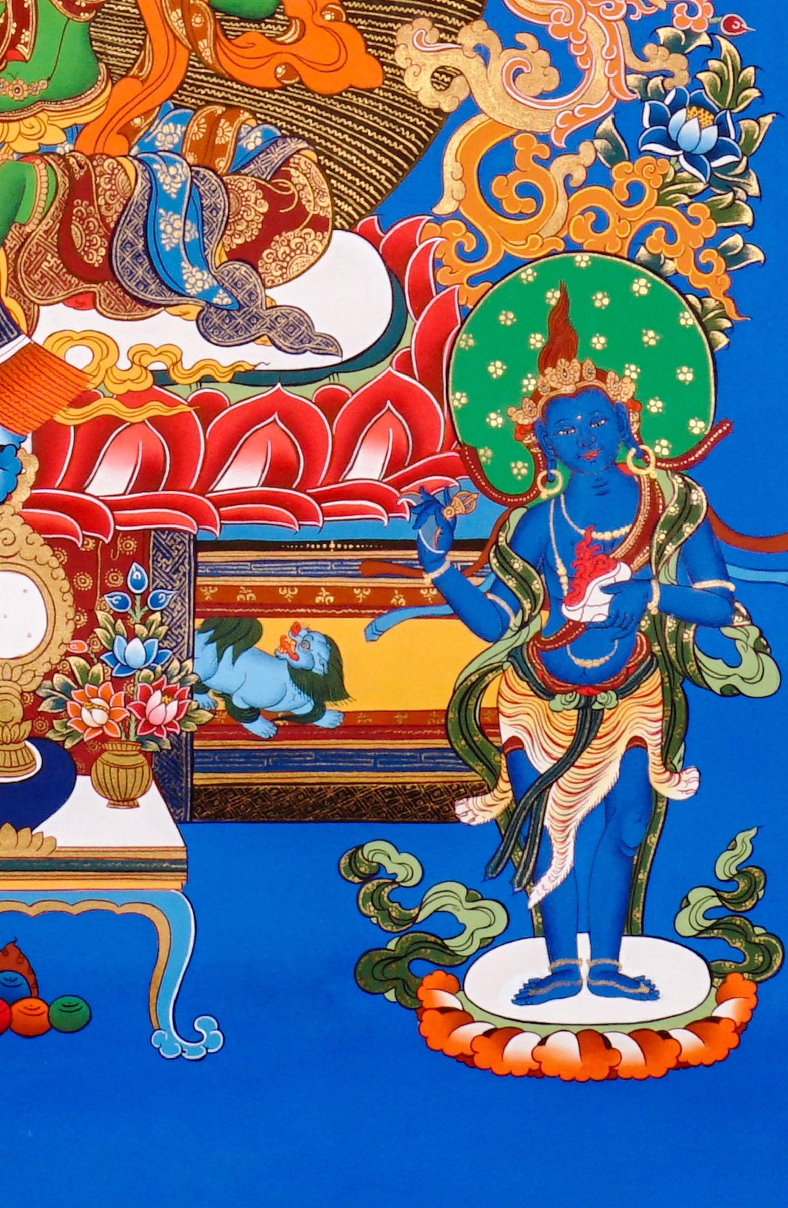 Hand-painted Green Tara thangka featuring the Tibetan Buddhist goddess seated on a lotus throne surrounded by sacred floral motifs and celestial symbolism