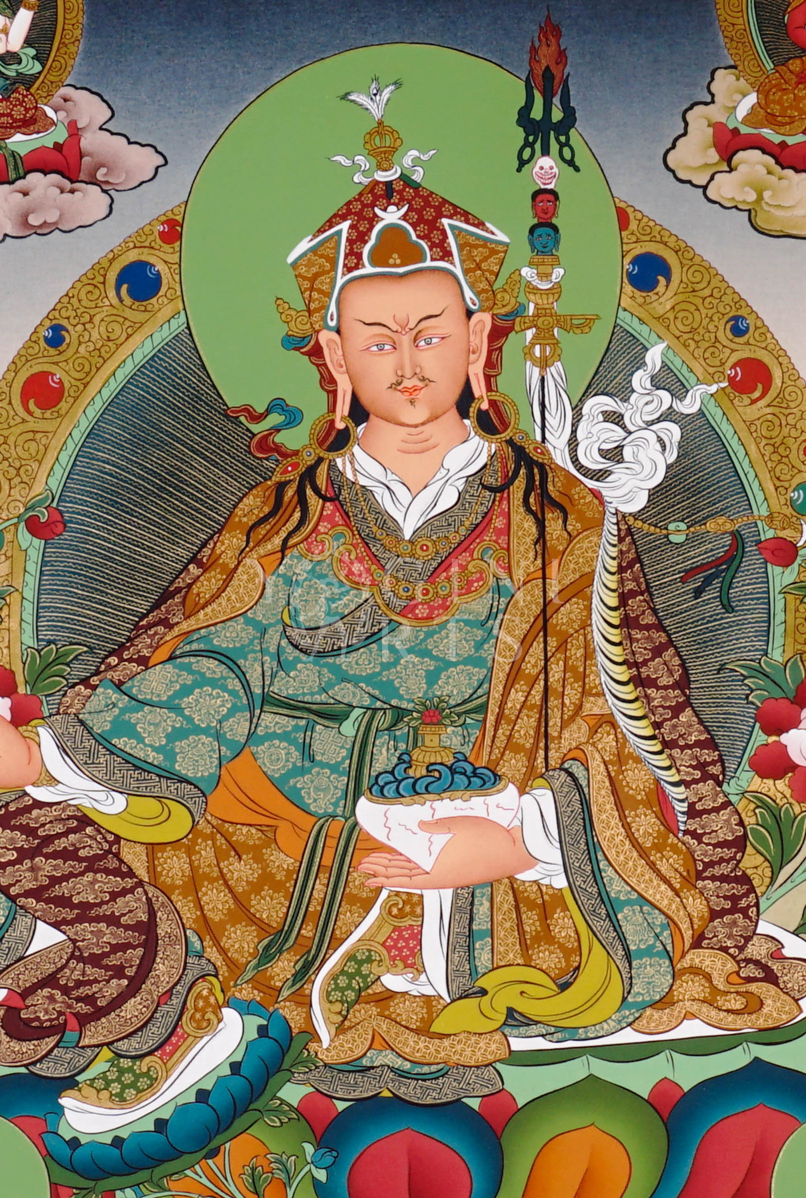 Guru Rinpoche thangka featuring Padmasambhava seated on a lotus throne holding vajra and skull cup surrounded by Buddhist deities and Himalayan scenery