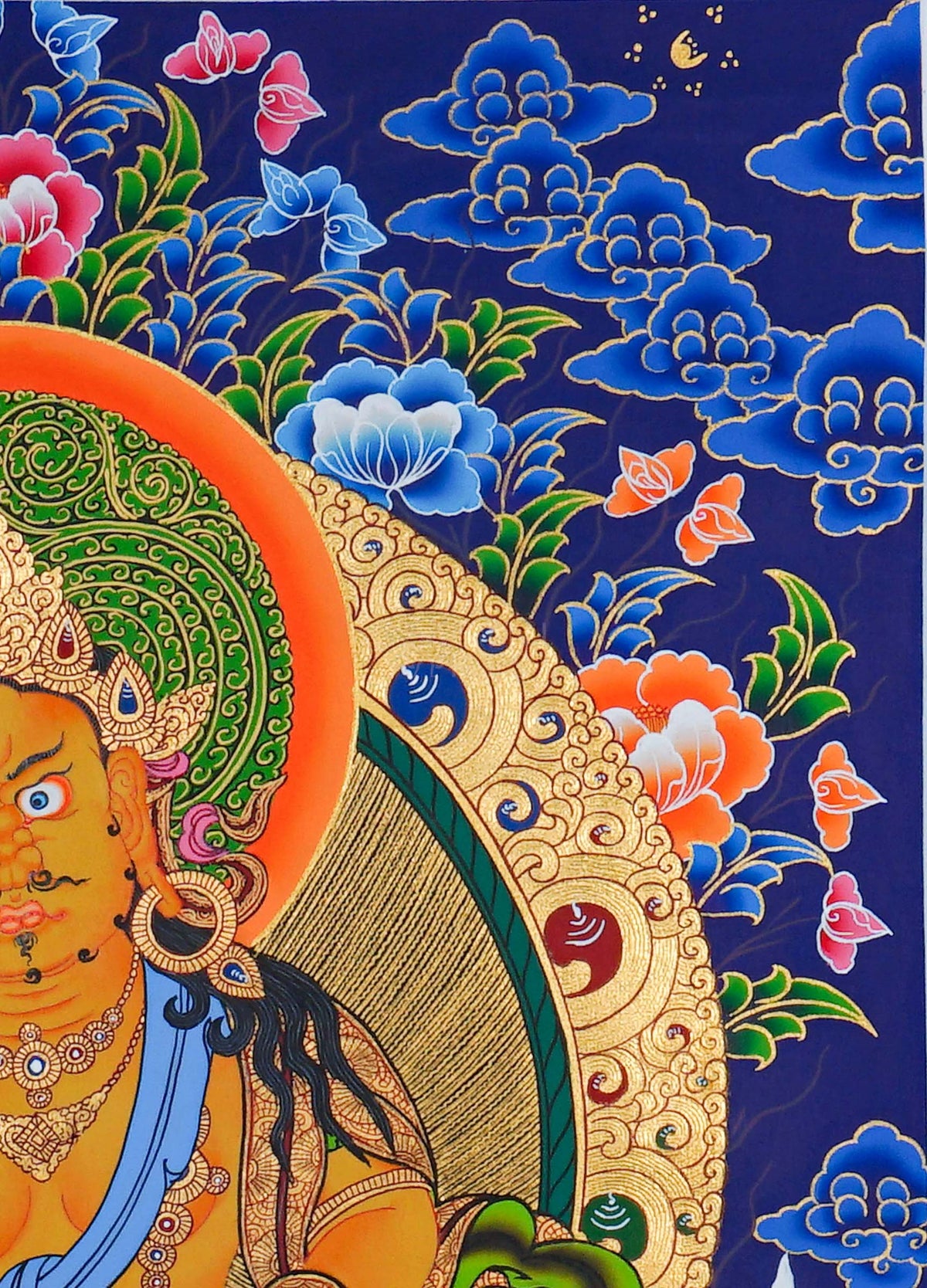 Hand painted Zambala Thangka painting depicting the Buddhist deity of prosperity seated on a lotus throne in traditional Nepalese Buddhist art