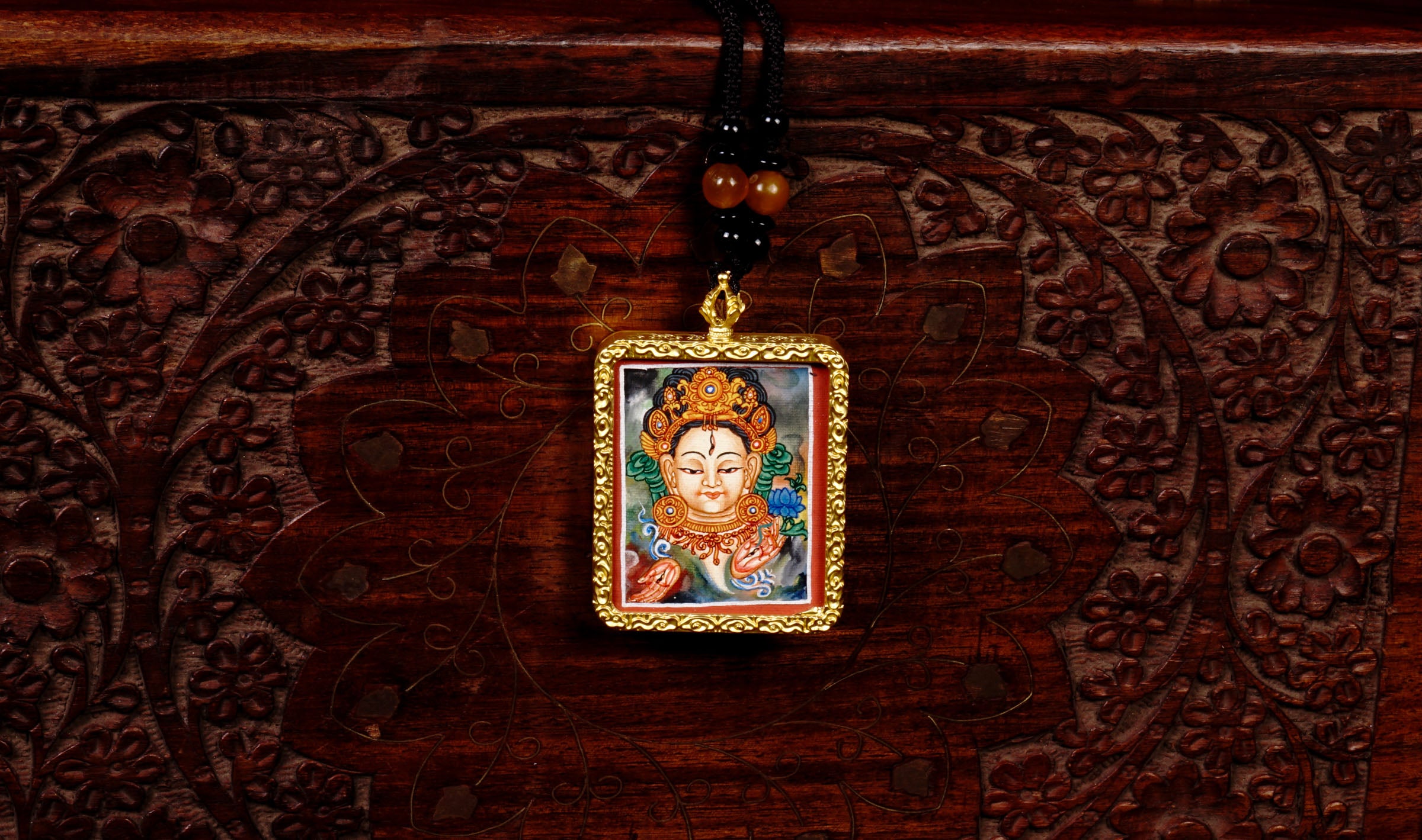 Hand-painted White Tara miniature Thangka pendant in gold-accented copper Ghau locket with black beaded cord.