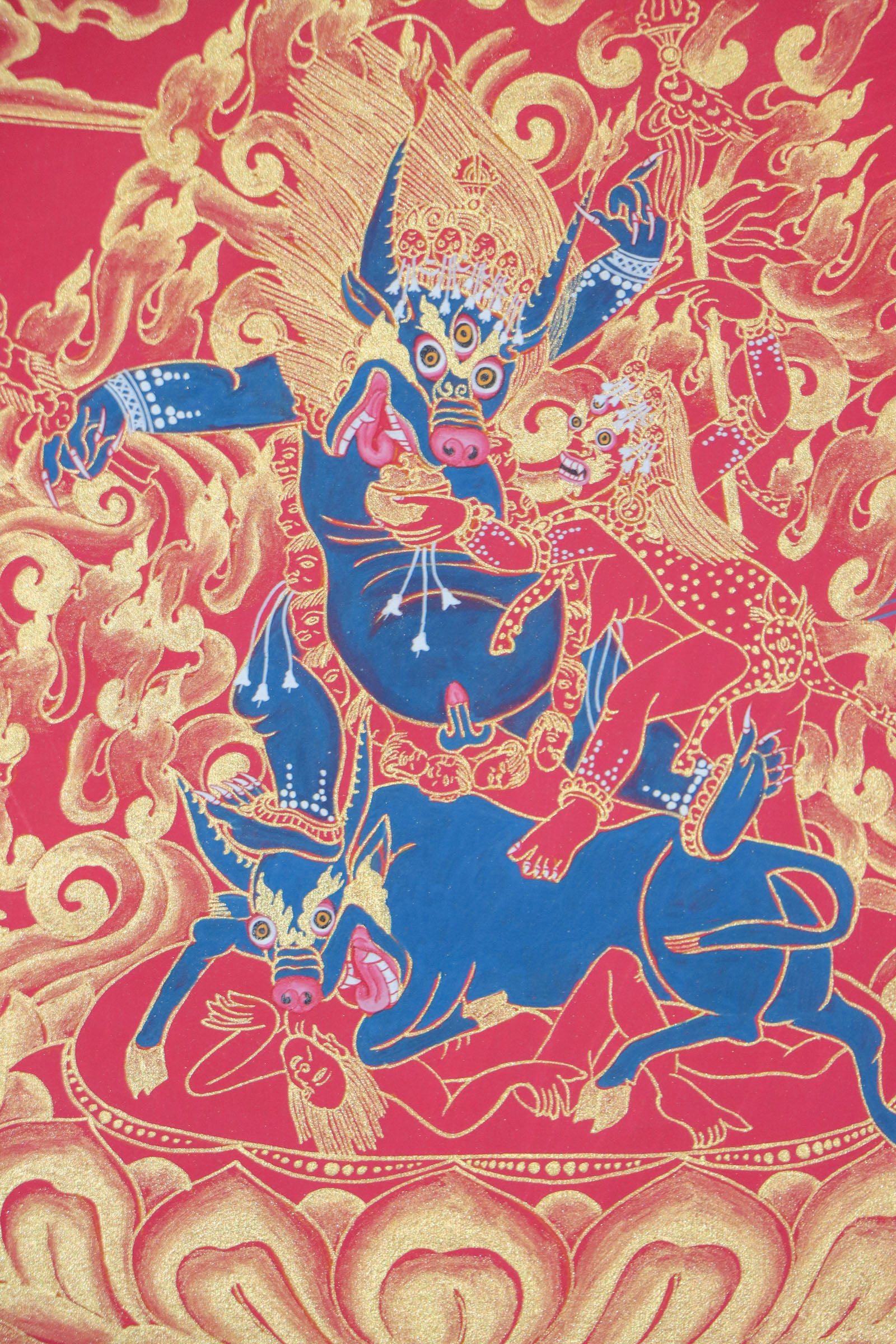 Yamantaka, a wrathful deity in Tibetan Buddhism, represents the destruction of death and ignorance. This genuine Tibetan thangka captures his fierce energy and is a powerful symbol of spiritual transformation.