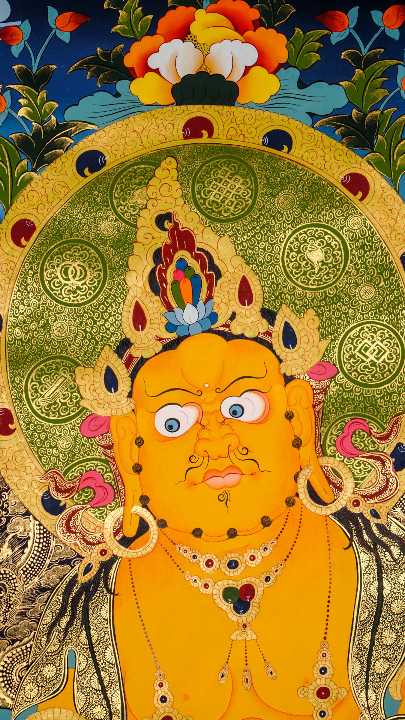 Zambala is a Tibetan Buddhist deity of wealth and prosperity. This genuine hand-painted thangka shows him holding a jewel-spouting mongoose and citron fruit, symbols of abundance and success. Made with natural mineral pigments on authentic canvas, this thangka attracts wealth, removes obstacles, and supports spiritual growth.

