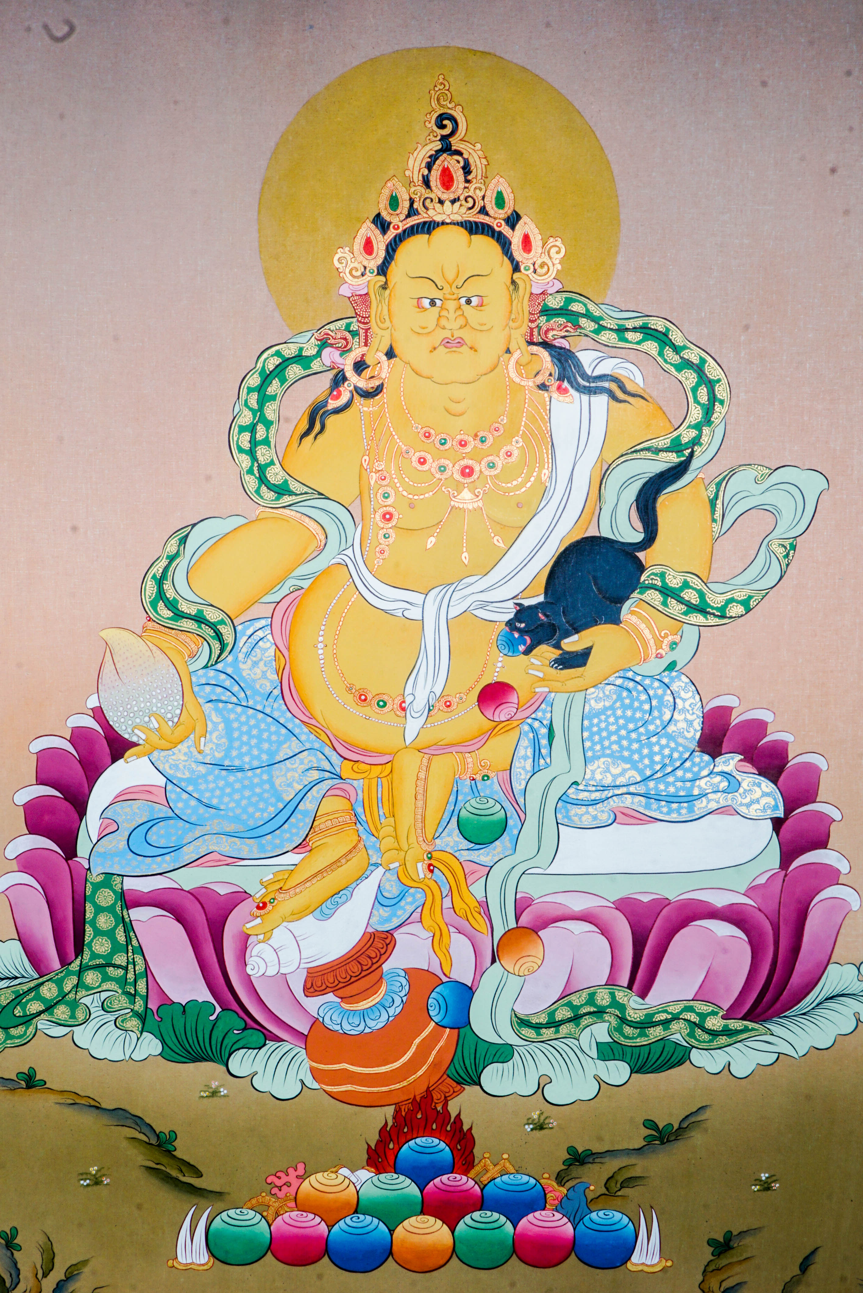 Zambala Thangka Painting features Zambala, the Tibetan Buddhist deity of wealth and prosperity, symbolizing abundance and success. Handcrafted by skilled artisans with intricate designs and natural pigments, this authentic Tibetan artwork embodies blessings of financial fortune and spiritual growth, making it a powerful symbol of prosperity and compassion.