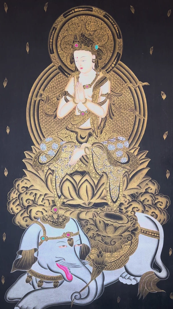 Hand-painted Samantabhadra thangka in gold on black canvas featuring the Buddhist bodhisattva seated on a white elephant with hands in prayer gesture