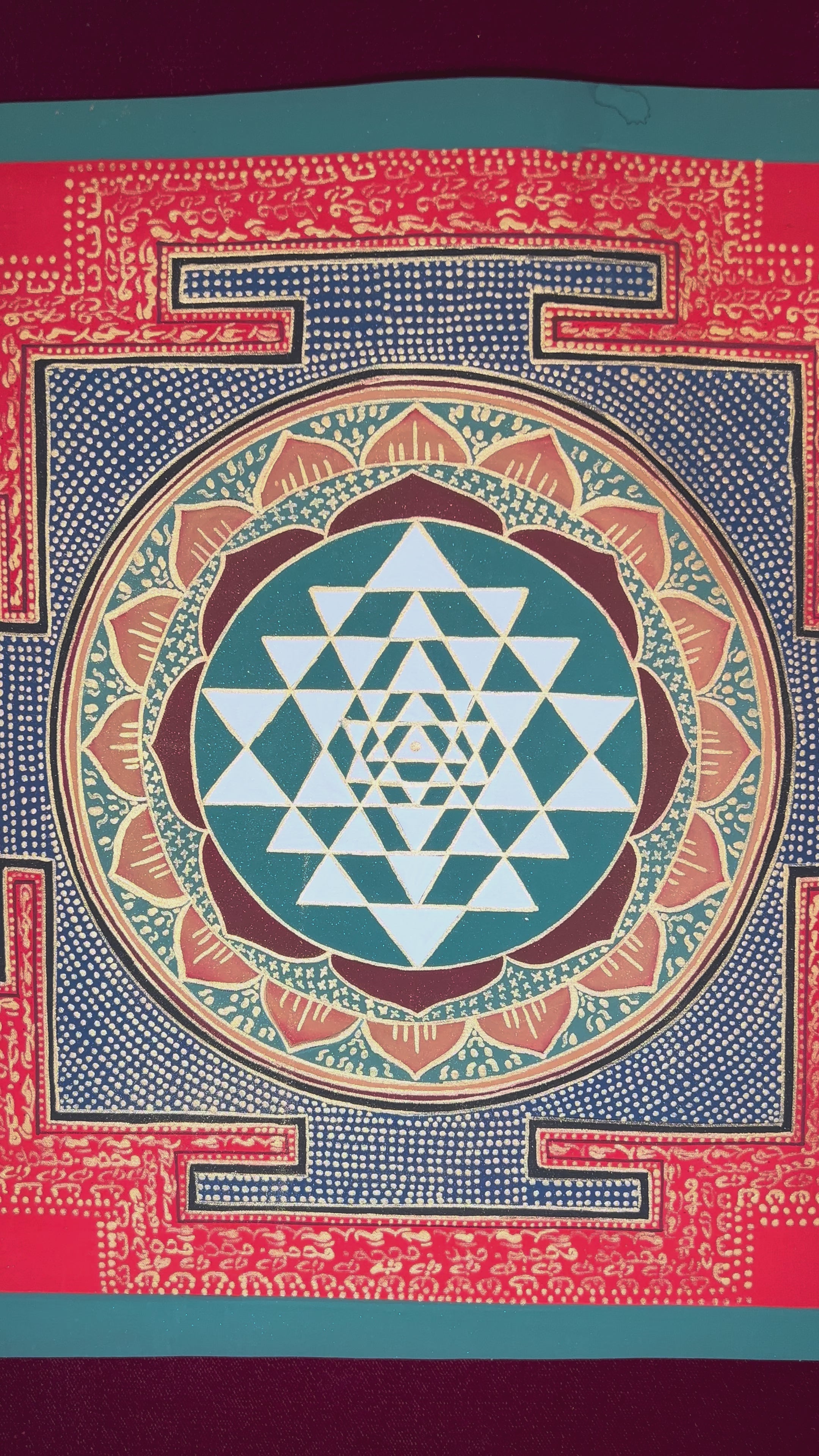 Hand-painted Shree Yantra mandala featuring sacred geometric triangles within a red Tantric border and lotus circle