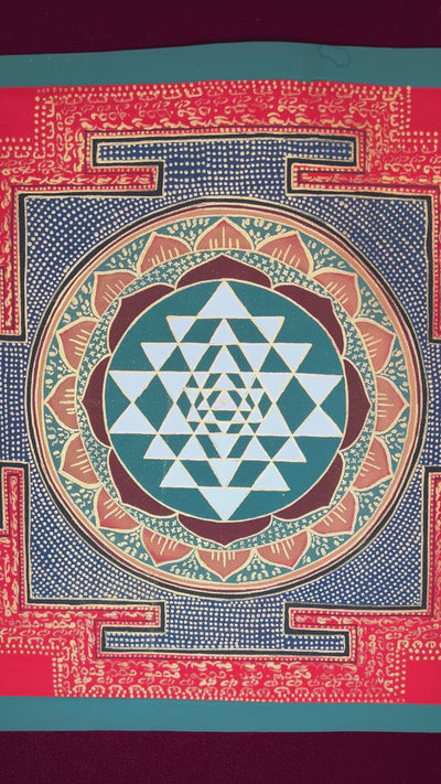 Hand-painted Shree Yantra mandala featuring sacred geometric triangles within a red Tantric border and lotus circle