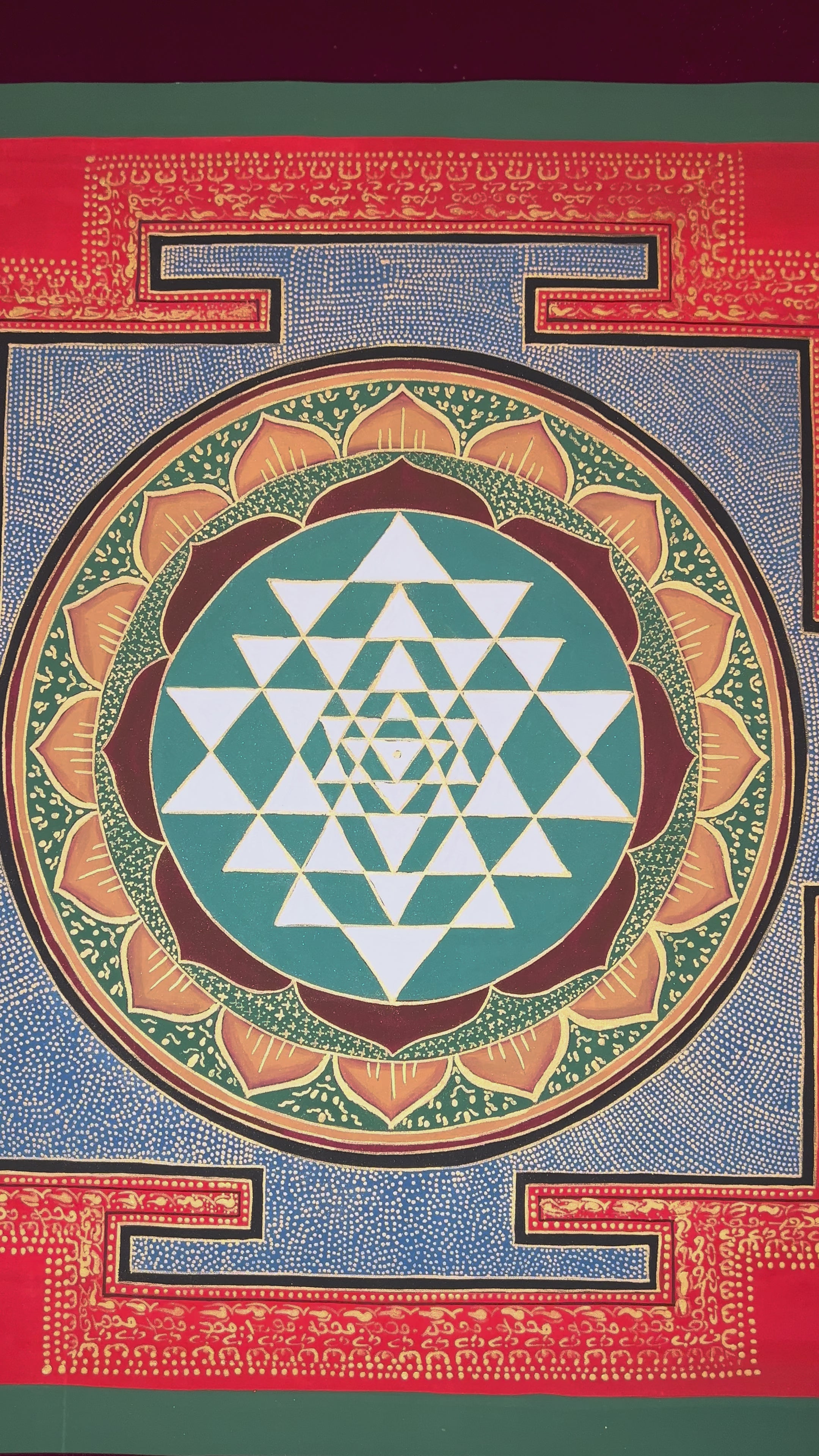 Hand-painted Shree Yantra mandala artwork featuring sacred geometric triangles within a lotus circle and red Tantric border