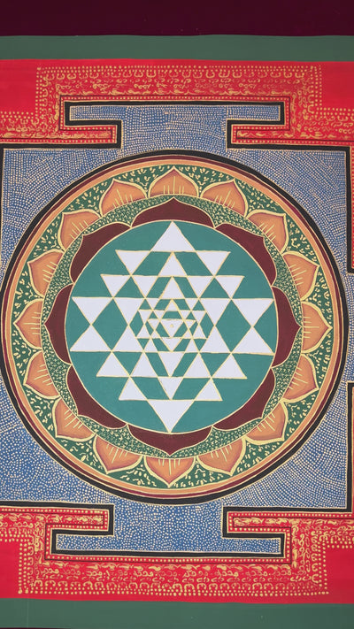 Hand-painted Shree Yantra mandala artwork featuring sacred geometric triangles within a lotus circle and red Tantric border