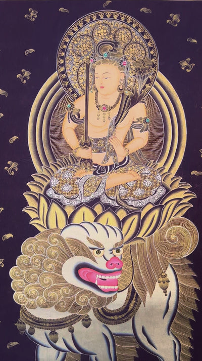 Hand-painted Manjushri on snow lion thangka in gold on black canvas featuring the Buddhist wisdom deity holding a flaming sword and lotus scripture