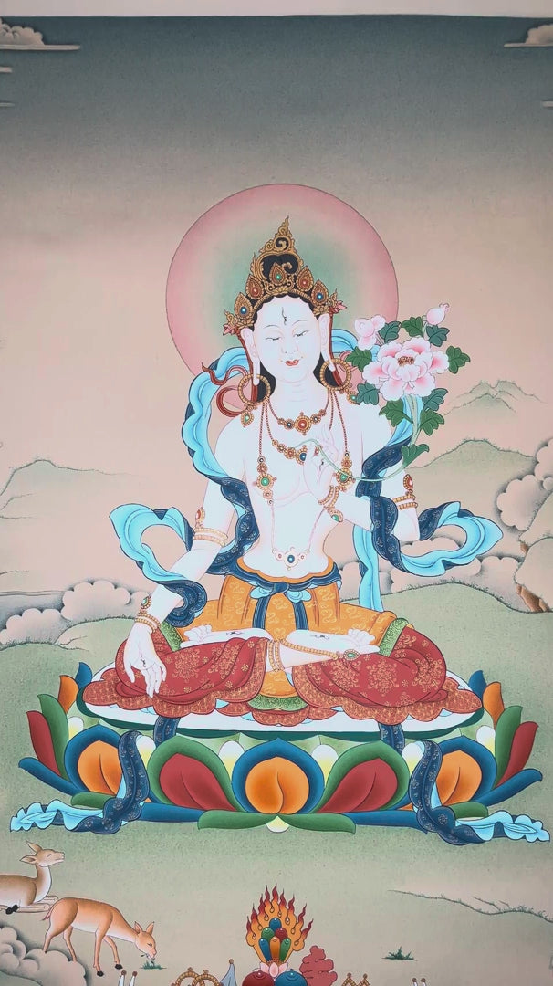 Hand-painted White Tara thangka featuring the Tibetan Buddhist goddess seated on a lotus throne holding a lotus flower within a peaceful Himalayan landscape