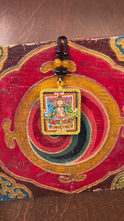 Hand-painted Fushen Fusa miniature Thangka pendant in gold-accented copper Ghau locket with black beaded cord.
