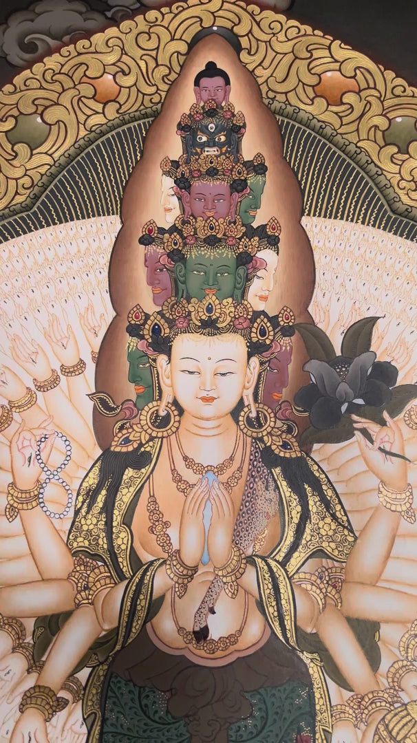 Hand-painted Thousand-Armed Avalokiteshvara Thangka depicting the eleven-faced Chenrezig with a thousand arms, natural mineral pigments, gold detailing, and a traditional Himalayan landscape.