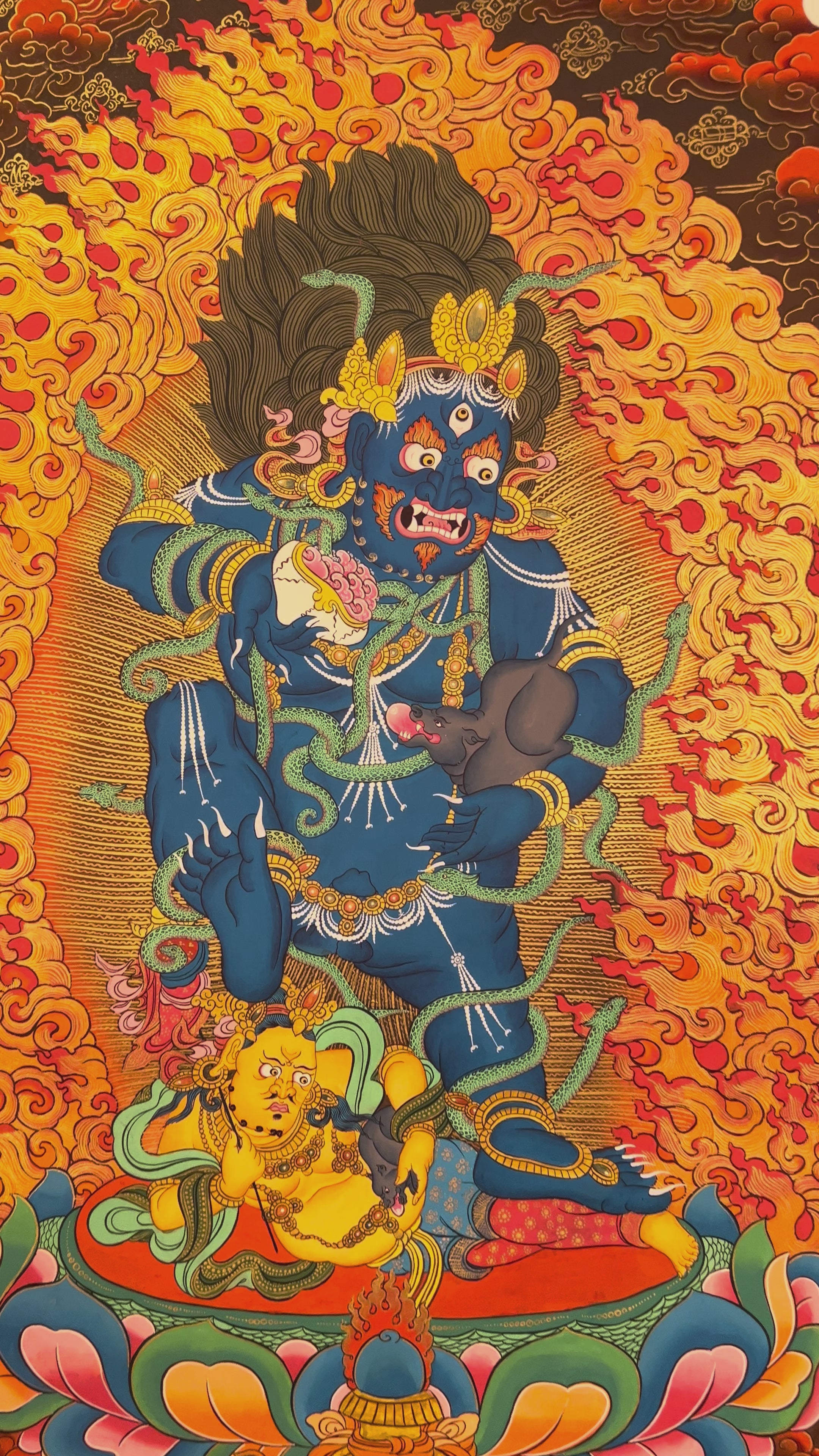 Hand-painted Black Zambhala thangka showing wrathful blue deity with flames, mongoose, and skull cup.