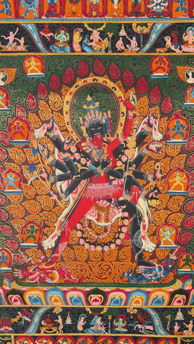 Hand-painted Kalachakra thangka showing multi-armed wrathful deity in union within intricate mandala structure surrounded by tantric figures.