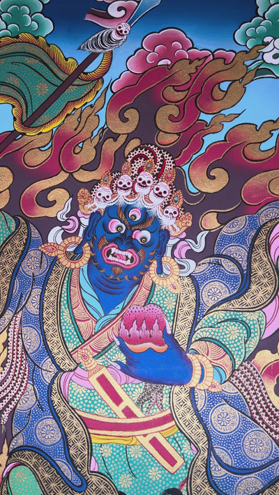 Khadga Pani thangka featuring a wrathful blue deity holding a sword, surrounded by flames and standing on subdued figures in traditional Tibetan style.