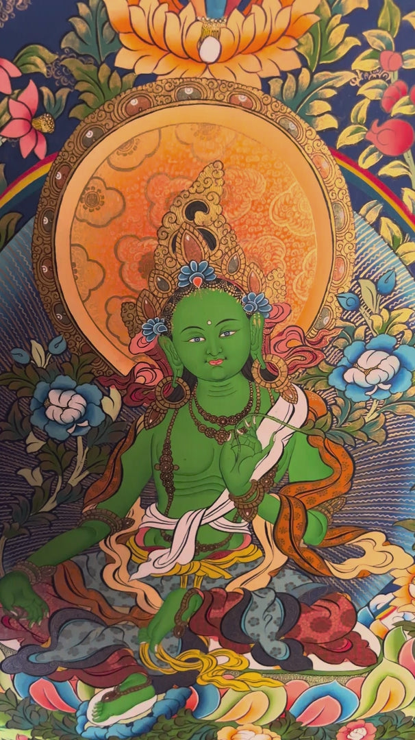 Green Tara Thangka painting depicting Green Tara seated on a lotus throne surrounded by flowers, clouds and intricate traditional Tibetan Buddhist artwork from Nepal