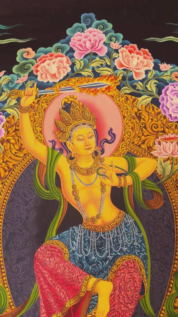 Newari Manjushree Tibetan thangka featuring the dancing Bodhisattva of Wisdom holding a flaming sword above a lotus throne with ornate floral designs