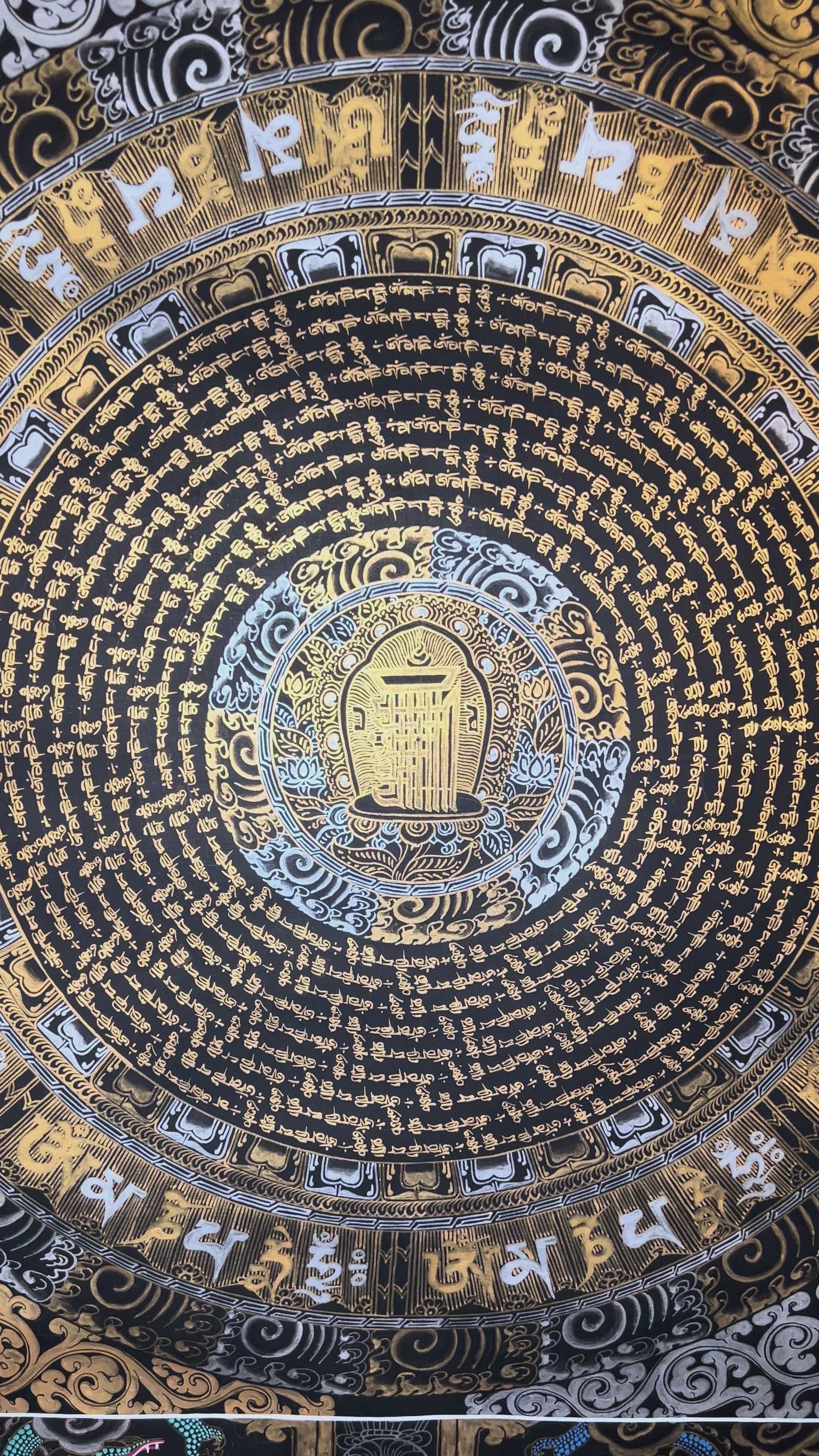 Mantra mandala thangka featuring sacred Buddhist calligraphy, gold detailing, concentric geometric patterns, and traditional Himalayan spiritual symbolism