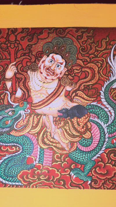 Panoramic red-background Tibetan thangka featuring Five Dzambhala wealth deities surrounded by gold clouds holding jewel-spitting mongoose symbols.