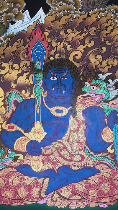 Yamaraj thangka showing a blue wrathful deity holding a staff and noose, seated in a powerful posture surrounded by golden clouds in Tibetan style.