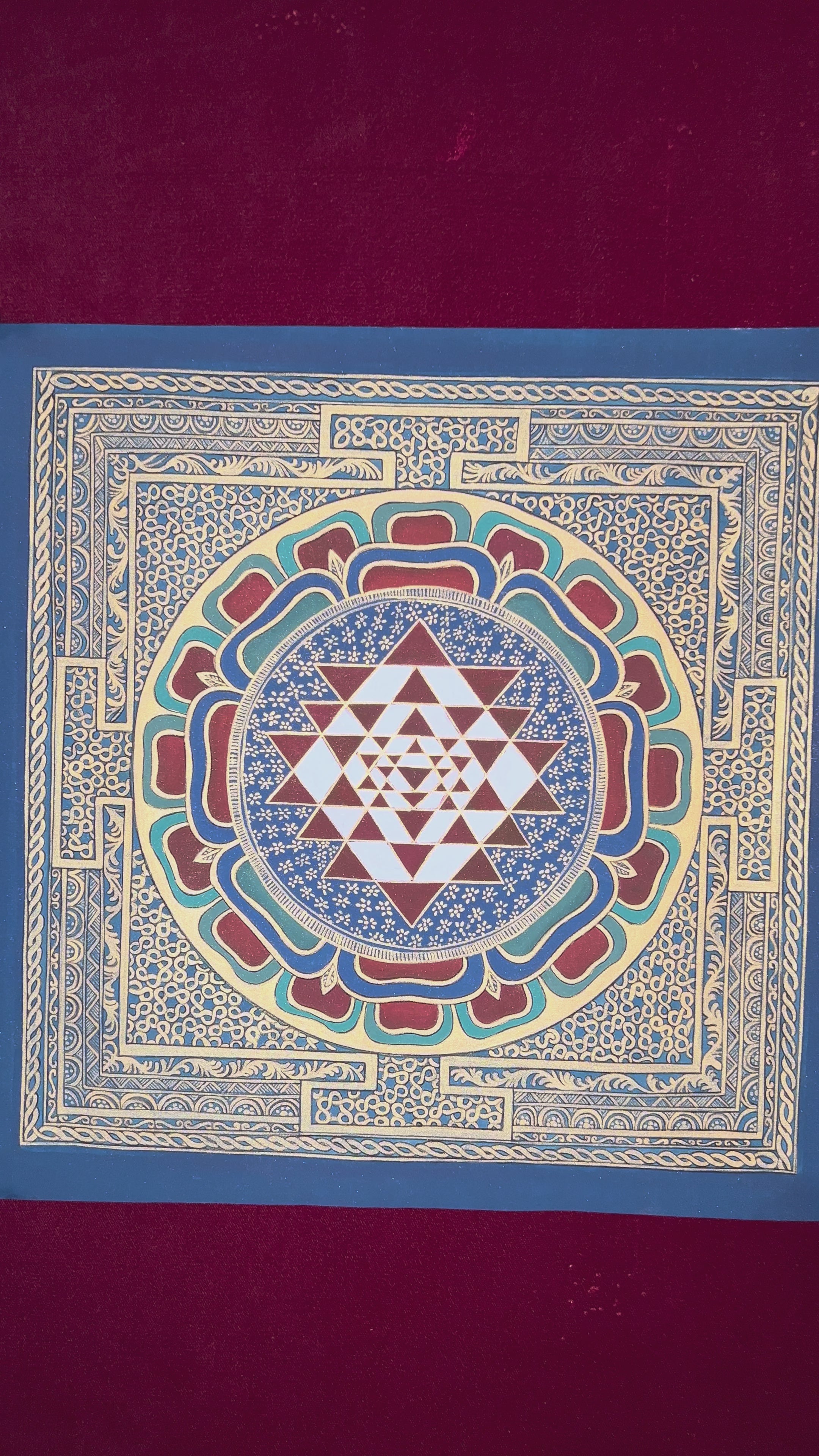 Hand-painted traditional Shree Yantra mandala with sacred geometric triangles, lotus layers, and intricate gold-style ornamental borders