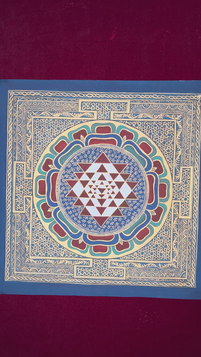 Hand-painted traditional Shree Yantra mandala with sacred geometric triangles, lotus layers, and intricate gold-style ornamental borders