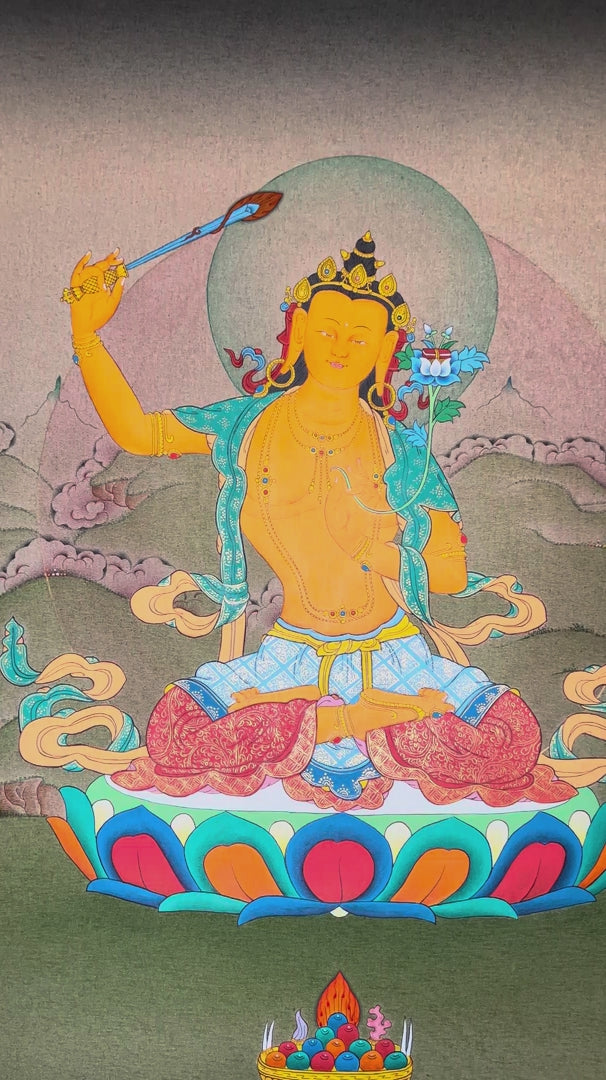 Hand-painted Manjushree thangka featuring the Buddhist wisdom deity seated on a lotus throne holding a flaming sword and lotus scripture in a Himalayan landscape