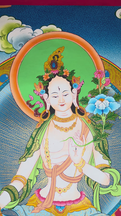 Hand-painted White Tara thangka featuring the Tibetan Buddhist goddess seated on a lotus throne surrounded by flowers, rivers, and peaceful Himalayan landscape
