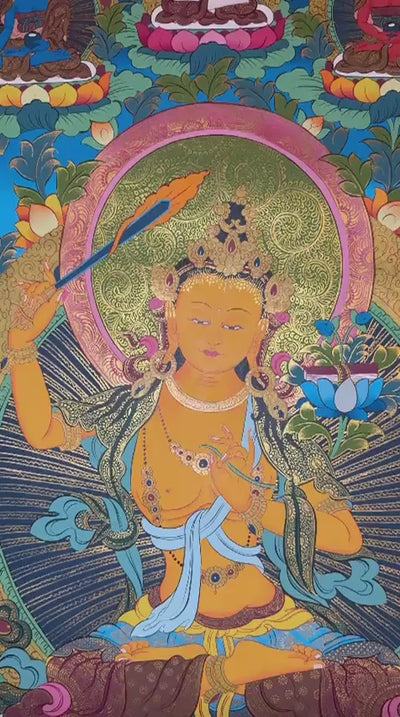  Manjushree thangka featuring the  wisdom deity holding a flaming sword and sacred scripture surrounded by Buddhas, lotus flowers, and ornate gold detailing